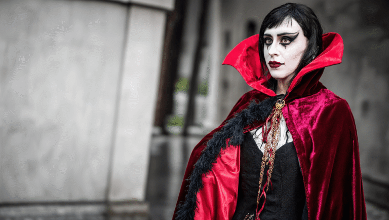 Halloween Cosplay: My Complete Guide to Creating Show-Stopping Character Transformations A vampire costume featuring a burgundy velvet cape and dramatic makeup, set against a clean background.