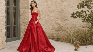 The Classic Red Satin Anniversary Dress: Timeless Elegance A beautifully styled red satin dress draped elegantly on a mannequin, surrounded by vibrant garnishes and textured food items, highlighting the contrast between fashion and culinary art.
